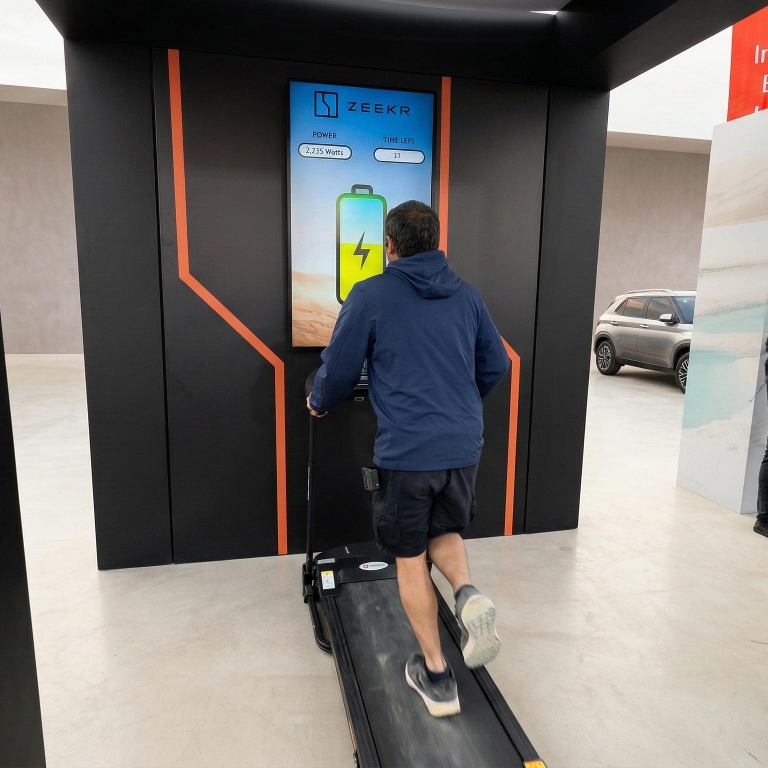 Interactive Treadmill Activation in Dubai: Participants generating human power to recharge EV cars